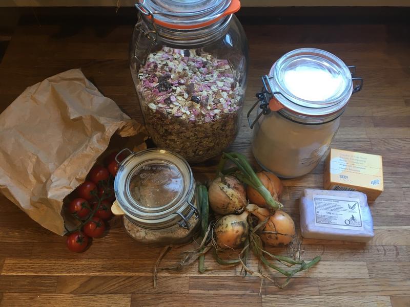 Photo of an assortment of foods and toiletries in paper packaging and glass jars