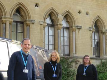 Photo of Rodger Caseby, Kate Jaeger, and Susie Glover standing outside the Oxford University Museum of Natural History