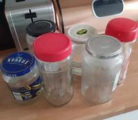 Photo of six assorted glass jars on a kitchen counter